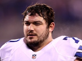 Zack Martin of the Dallas Cowboys walks off the field after a loss to the New York Giants at MetLife Stadium on Dec. 11, 2016 in East Rutherford, N.J.