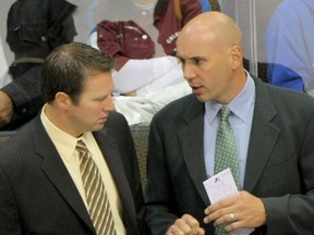 In this Sept. 23, 2009 file photo, Colorado Avalanche head coach Joe Sacco, left, and assistant coach Sylvain Lefebvre talk as they lead their team against the Los Angeles Kings during preseason NHL action at the Pepsi Center in Denver.