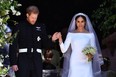 Britain's Prince Harry, Duke of Sussex and his wife Meghan, Duchess of Sussex leave from the West Door of St George's Chapel, Windsor Castle, in Windsor on May 19, 2018 in Windsor, England.