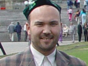 Huseyin Celil stands in front of the Canadian Parliament buildings in Ottawa, May 2005.