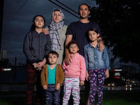 Mohammad Ehsan Saadat, top left, with wife Tamana and children (from left) Eman, 11, Mohammad Naaman, 2, Narwan, 4 and Zahra, 7. The family was photographed in Waterloo, Ont. on Tuesday, Sept. 7, 2021