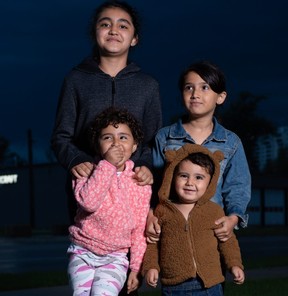 Mohammad Ehsan Saadat’s children ham it up for the camera in Waterloo, Ont. on Tuesday, Sept. 7, 2021