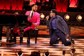 John Legend (left) performs with the cast of “Ain’t Too Proud” onstage during the 74th Annual Tony Awards at Winter Garden Theatre in New York City, Sunday, Sept. 26, 2021.