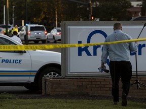 Crime scene tape is seen outside of a Kroger grocery store where a shooting occurred in Collierville, Tenn., Thursday, Sept. 23, 2021.