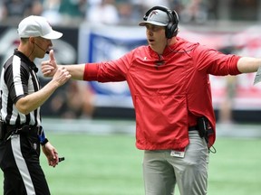 Atlanta Falcons head coach Arthur Smith talks with the referee against the Philadelphia Eagles during the first quarter at Mercedes-Benz Stadium. Officials have been specifically instructed this season to call offensive holding more or less on pre-2019 thresholds, league sources told Postmedia this week. USA TODAY