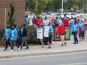 About 200 people marched around Fanshawe College to protest against sexual violence on campus in London. (Derek Ruttan/The London Free Press)