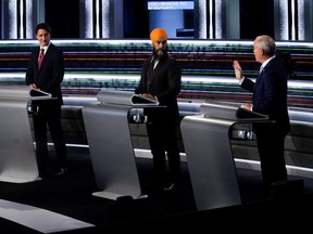 From left to right, Liberal Leader Justin Trudeau, NDP Leader Jagmeet Singh, and Conservative Leader Erin O'Toole take part in the English-language Leaders debate in Gatineau, Que., Sept. 9, 2021.