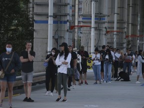 Voters in the Spadina-Fort York riding gather from Fort York to Bathurst St. under The Beltway on Monday, Sept. 20.