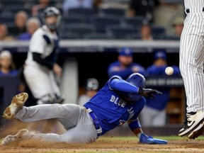Blue Jays baserunner Lourdes Gurriel Jr. scores on a wild pitch by Yankees pitcher Lucas Luetge during the fourth inning at Yankee Stadium in New York City, Wednesday, Sept. 8, 2021.