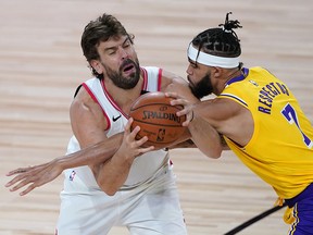 Marc Gasol handles the ball against Los Angeles Lakers centre JaVale McGee at The Arena.