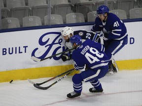 Leafs prospect Jeremy McKenna (41), here working the boards for he Marlies, scored twice in a rookie tourney win over the Blues yesterday in Michigan.