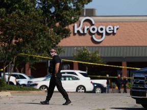 Emergency personnel respond to a shooting at a Kroger grocery store in suburban Memphis, Thursday, Sept. 23, 2021.