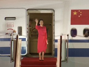 Huawei Technologies Chief Financial Officer Meng Wanzhou waves upon arriving from Canada at Shenzhen Baoan International Airport, in Shenzhen, Guangdong province, China September 25, 2021.