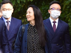 Huawei Chief Financial officer Meng Wanzhou leaves her Vancouver home to attend her extradition hearing, Sept. 24, 2021, in Vancouver.