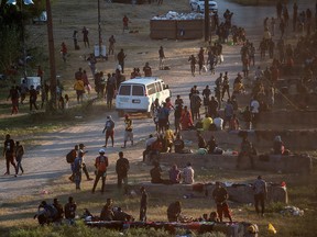 Migrants seeking asylum in the U.S. rest near the International Bridge between Mexico and the U.S. as they wait to be processed, in Del Rio, Texas, September 16, 2021.