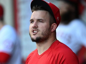 Angels outfielder Mike Trout eats sunflower seeds in the dugout during a game against the Astros at Angel Stadium of Anaheim in Anaheim, Calif., Sept. 21, 2021.