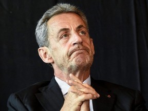 Former French President Nicolas Sarkozy looks on during a ceremony held to award Mayor of Calais as Knight of the Legion of Honour in the city hall in Calais, France, Sept. 22, 2021.