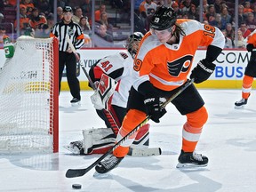 Nolan Patrick of the Philadelphia Flyers tries to get a shot off on Craig Anderson of the Ottawa Senators at Wells Fargo Center on March 11, 2019 in Philadelphia.