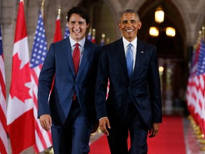 In this file photo taken on June 28, 2016 Prime Minister Justin Trudeau (L) and President Barack Obama exit the Hall of Honour on Parliament Hill following the North American Leaders Summit in Ottawa.
