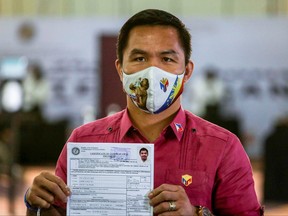 Philippine senator and newly retired boxing icon Manny Pacquiao files his certificate of candidacy to join the presidential race, at Sofitel Harbor Garden Tent, in Pasay City, Metro Manila, Philippines, Oct. 1, 2021.