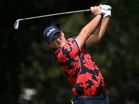 Patrick Reed plays his shot from the second tee during the first round of the Tour Championship golf tournament in Atlanta, Ga., Sept. 2, 2021.