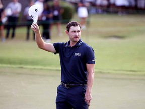 Patrick Cantlay celebrates on the 18th green after winning the TOUR Championship at East Lake Golf Club on September 5, 2021 in Atlanta.