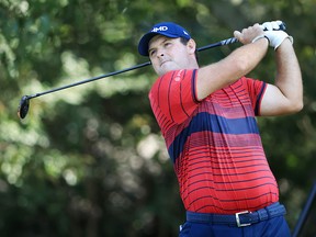 Patrick Reed plays his shot from the third tee during the final round of the TOUR Championship on September 5, 2021 in Atlanta.