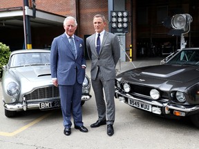 Prince Charles poses with actor Daniel Craig as he tours the set of the 25th James Bond Film at Pinewood Studios in Iver Heath, Buckinghamshire, Britain June 20, 2019.