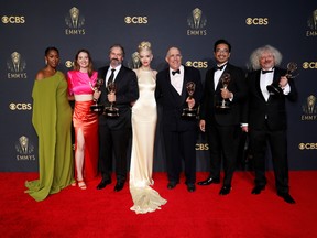 Actors Moses Ingram, Marielle Heller and Anya Taylor-Joy pose for a picture along with producers Scott Frank, Allan Scott, Mick Ancieto and Marcus Loges, with their awards for "The Queen's Gambit", at the 73rd Primetime Emmy Awards in Los Angeles, September 19, 2021.