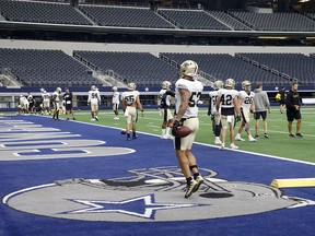 The New Orleans Saints participate in a workout at AT&T Stadium in Arlington, Texas, Monday, Aug. 30, 2021.