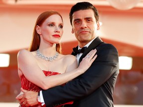 Jessica Chastain and Oscar Isaac pose on the read carpet at the 78th Venice Film Festival.