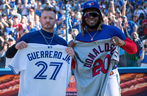 Former Blue Jays star Josh Donaldson (left) and current MVP candidate Vladimir Guerrero Jr. exchange jerseys after Toronto defeated the Twins on Sunday, Sept. 19, 2021.