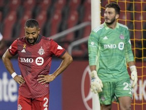 Toronto FC defender Justin Morrow (left) and goalkeeper Alex Bono react after a penalty kick is awarded to Inter Miami CF in extra time at the end of the second half at BMO Field on Sept. 14, 2021.