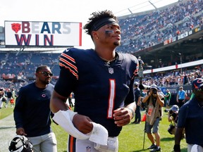 Chicago Bears quarterback Justin Fields runs off the field after his team's 20-17 win over the Cincinnati Bengals at Soldier Field on Sept. 19, 2021.