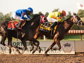 Jockey Gary Boulanger guides Haddassah (right) to victory in the $400,000 Prince of Wales Stakes on Sept. 14, 2021, at Fort Erie.