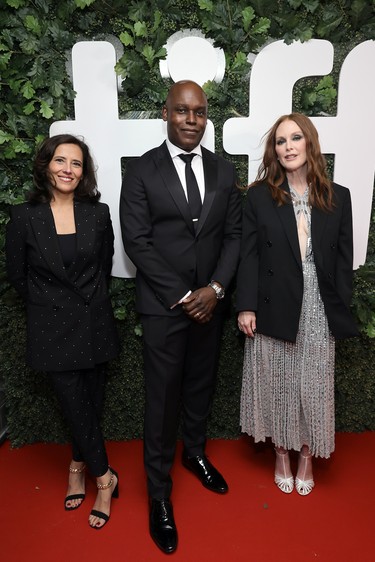 From left to right, Executive Director and the Co-Head of the Toronto International Film Festival Joana Vicente, Co-Head and Artistic Director of TIFF and the Toronto International Film Festival Cameron Bailey, and Julianne Moore attend the "Dear Evan Hansen" Premiere during the 2021 Toronto International Film Festival at Roy Thomson Hall on Sept. 9, 2021.