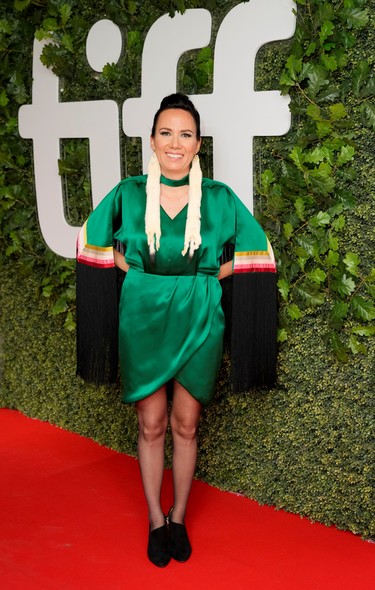 Director Danis Goulet poses on the red carpet at the premiere of the thriller Night Raiders, at the Toronto International Film Festival, Sept. 10, 2021.