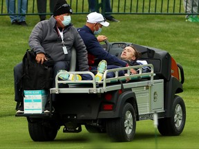 Tom Felton is carted off the course after collapsing during the celebrity matches ahead of the 43rd Ryder Cup at Whistling Straits on Sept. 23, 2021 in Kohler, Wisconsin.