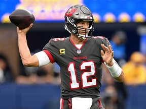 Tampa Bay Buccaneers quarterback Tom Brady (12) throws a pass in the first half of the game against the Los Angeles Rams at SoFi Stadium.