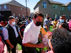 Prime Minister Justin Trudeau greets supporters at an election campaign stop on the last campaign day before the election in Vaughan September 19, 2021.