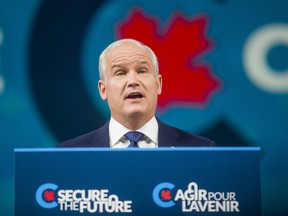 Conservative Leader Erin O'Toole addresses supporters at the Tribute Communities Centre Arena in Oshawa, Ont. following the federal election on September 21, 2021.