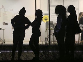 Voters line up to cast a ballot during the federal election on Monday September 20, 2021.