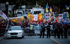 Supporters and protesters chant before the TVA as the various political leaders arrive for the Face-a-Face 2021 debate in Montreal on Sept. 2, 2021.