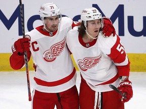 Tyler Bertuzzi (right) of the Detroit Red Wings gets a hug from Dylan Larkin after scoring against the Chicago Blackhawks at the United Center on January 24, 2021 in Chicago.