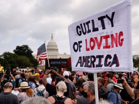 A sign is held during a rally in support of defendants being prosecuted in the Jan. 6 attack on the U.S. Capitol, in Washington, D.C., Saturday, Sept. 18, 2021.