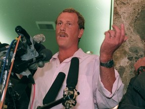 George Holliday, who captured the beating of Rodney King by Los Angeles Police officers on videotape, faces reporters during a 1991 press conference announcing a $100-million lawsuit against all television stations which broadcast his tape in violation of federal copyright laws.