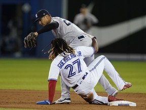 New York Yankees second baseman Gleyber Torres gets Blue Jays first baseman Vladimir Guerrero Jr. out at second base during the sixth inning at Rogers Centre on Tuesday, Sept. 28, 2021.