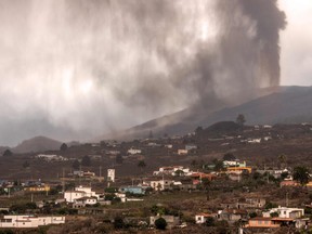 The volcano that went on erupting on Sept. 19 in Cumbre Vieja mountain range, spewes gas, ash and lava over the Aridane valley as seen from Los Llanos de Aridane on the Canary Island of La Palma, on Sept. 22, 2021.