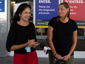 Wife of Michael Kovrig, Vina Nadjibulla (left) and his sister Ariana Botha speak to the media outside Toronto airport before seeing Michael in Toronto, on Saturday, Sept. 25, 2021. (LARS HAGBERG/AFP via Getty Images)