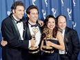 In this file photo taken on September 19, 1993 The cast of the Emmy-winning "Seinfeld" show (L-R) Michael Richards, Jerry Seinfeld, Julia Louis-Dreyfus and Jason Alexander pose with the Emmys they won for Outstanding Comedy Series on in Pasadena, California.